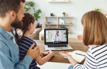 Happy family making video call to doctor.