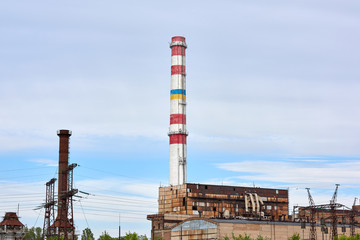Fototapeta na wymiar Brick pipe factory against a blue sky