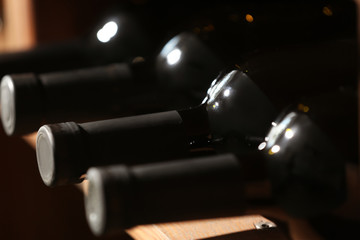 Bottles of wine in cellar, closeup