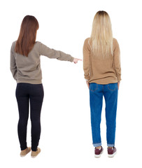 Back view of two young woman photographed on a mobile phone in sweater.