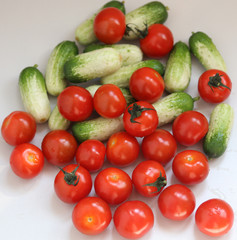 small cucumbers and cherry tomatoes close up