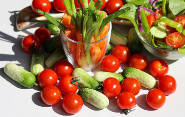small cucumbers and cherry tomatoes close up