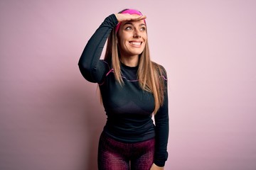 Young blonde fitness woman wearing sport workout clothes over isolated background very happy and...