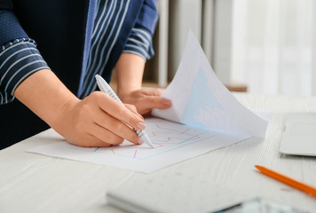 Female accountant working in office, closeup