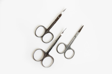 metal scissors for manicure and pedicure on a white background