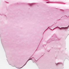 Pink cosmetic cream smear on white background. Beauty creme swipe. Skincare product creamy texture. Color corrector smudge swatch. Skin care. Mask for the face or body