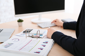 Female accountant working in office, closeup