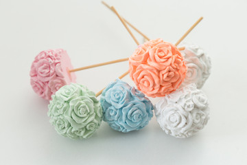 Scented stones like flowers on the white background.