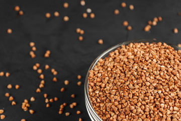 Buckwheat in a glass plate near the copy space top view.