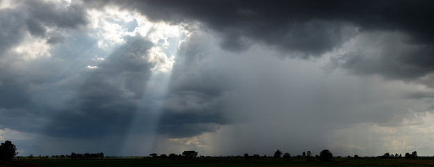 Panorama Super storm , Dark sky and dramatic black cloud before rain.rainy storm over rice fields Sisaket province Thailand.