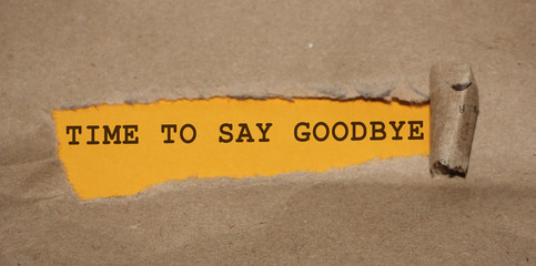 Torn Paper With Text Time to say Goodbye. Farewell concept, breaking relationship or end of...