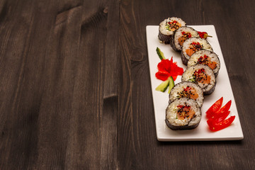 Korean roll Gimbap(kimbob). Steamed white rice (bap) and various other ingredients. Trendy black background