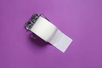 Holder with roll of toilet paper on color background