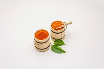 Two types of Hungarian paprika powder, hot and sweet, isolated on white background