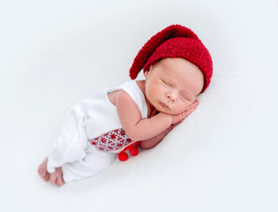 Cute newborn wearing emboidered shirt