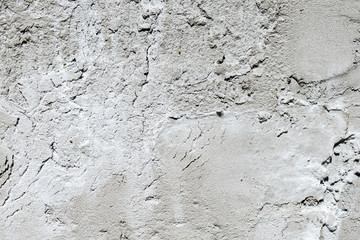 Grey concrete texture waal with shadows and highlites.