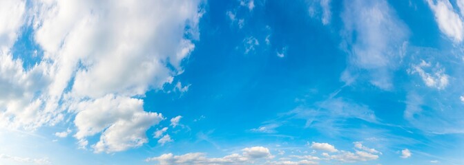 Panorama of a blue sky with white clouds as a backround