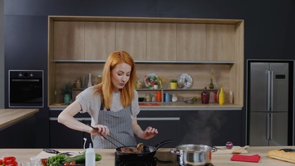Cooking show hosts celebrity chef shows how to cook meat. Morning TV cooking programme. Shot on ARRI Alexa Mini