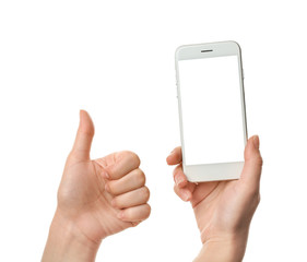 Female hands with mobile phone showing thumb-up gesture on white background