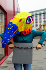 Masked woman - brightly colored bird head with a large beak. homemade original costume for the...