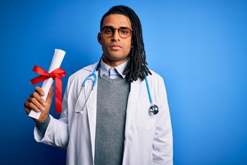 African american doctor man with dreadlocks wearing stethoscope holding diploma degree with a confident expression on smart face thinking serious