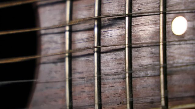 Classical Guitar strings Vibrate with waves of rolling shutter effect