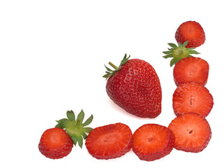 Isolated strawberries. One whole fruit and cut berries on white background
