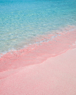 Pink sand beach and turquoise pristine water iin Crete, Greece