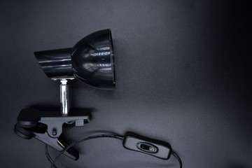 Black lamp on a black background