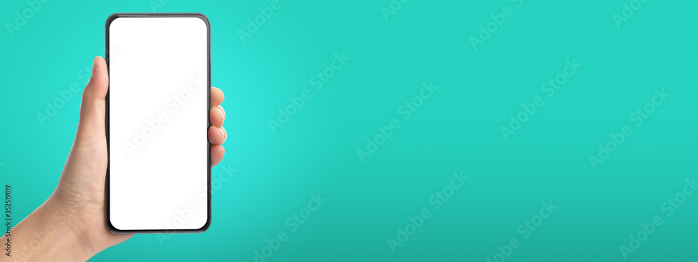 Poster mockup hand touch on mobile blank screen on green background in banner size for display of content to advertise on online media.technology background.clipping path on both hand and phone screen