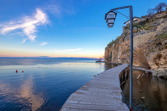 Ohrid. Wooden platform along ohrid lake at the foot of the Kaneo at sunset.
