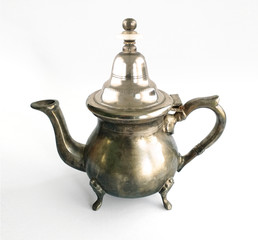 Classic silver arabic teapot isolated on white background. Close up of Old Moroccan teapot.