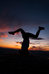 Woman making yoga in the mountain