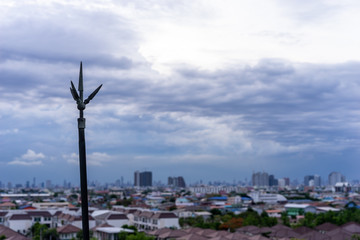 Lightning rod on the rooftop of condominium with cloudy sky