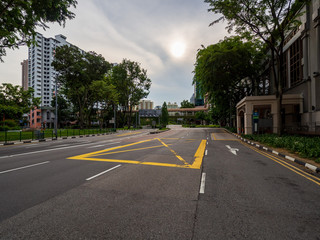 Fototapeta na wymiar Quiet Singapore street with less tourists and cars during the city lockdown called