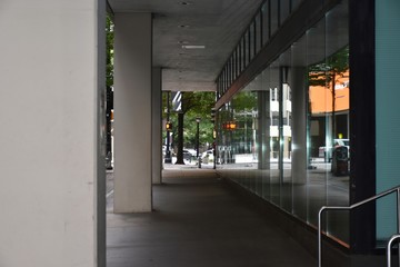 Outdoor pedestrian walkway with reflecting windows