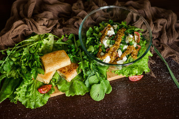 Obraz na płótnie Canvas Salad with fresh vegetables and pancakes. Top view.