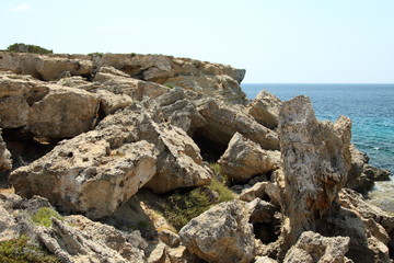 Sea rocky coast of Cyprus. Landscape vacation. Beautiful tourism. Summer view. Wallpaper and background.