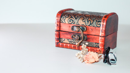 small wooden trunk with dried flowers