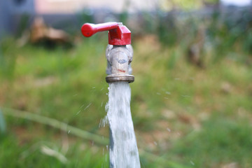 Water is flowing out of the tap.