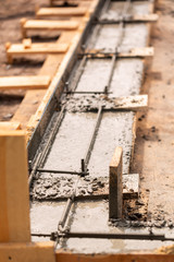 Lay of the cement or concrete into the foundation formwork with automatic pump
