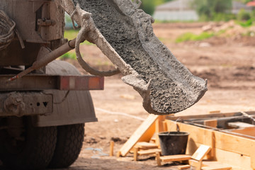 Lay of the cement or concrete into the foundation formwork with automatic pump