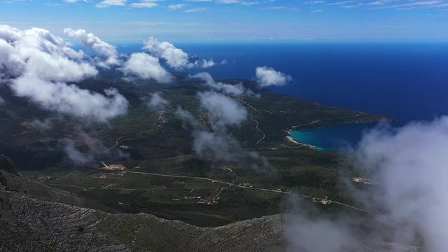 Beach coast near Areopoli city,cloudy mountains background 4k