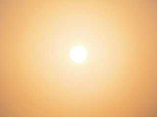 sun over golden clear sky background at sunrise