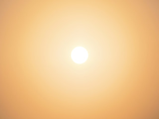 sun over golden clear sky background at sunrise