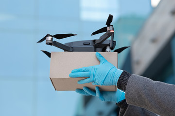 Quadcopter delivery service, modern cargo drone, close up