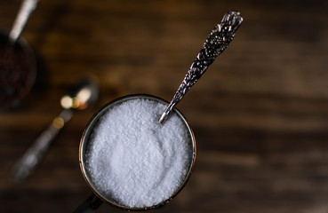 Himalayan salt isolated on a wooden background.