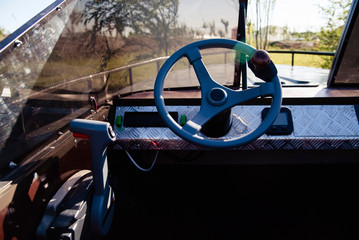 Instrument panel and steering wheel of a motor boat cockpit