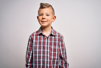 Young little caucasian kid with blue eyes wearing elegant shirt standing over isolated background with a happy and cool smile on face. Lucky person.