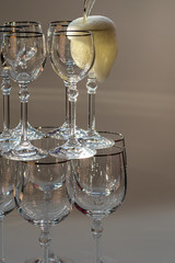 Beautiful glass with champagne and ice of different colors.